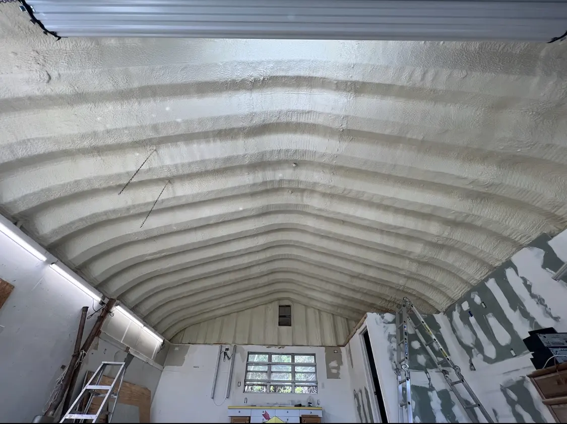Spray polyurethane foam applied to the underside of a metal roof deck in Waconia